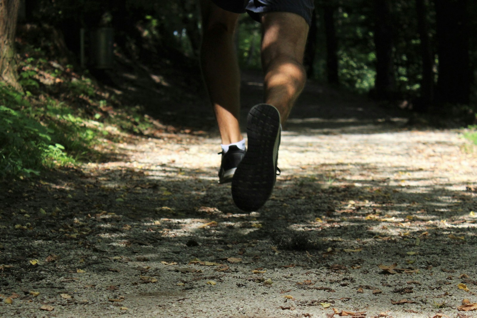 person in black nike sneakers